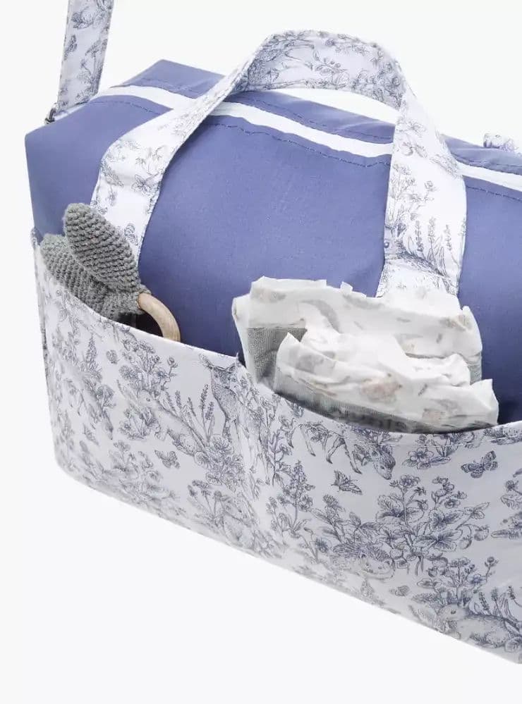 شنطة حفاضات بحزام قابل للتعديل وسحاب إغلاق وطبعات 