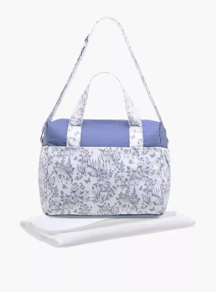 شنطة حفاضات بحزام قابل للتعديل وسحاب إغلاق وطبعات 